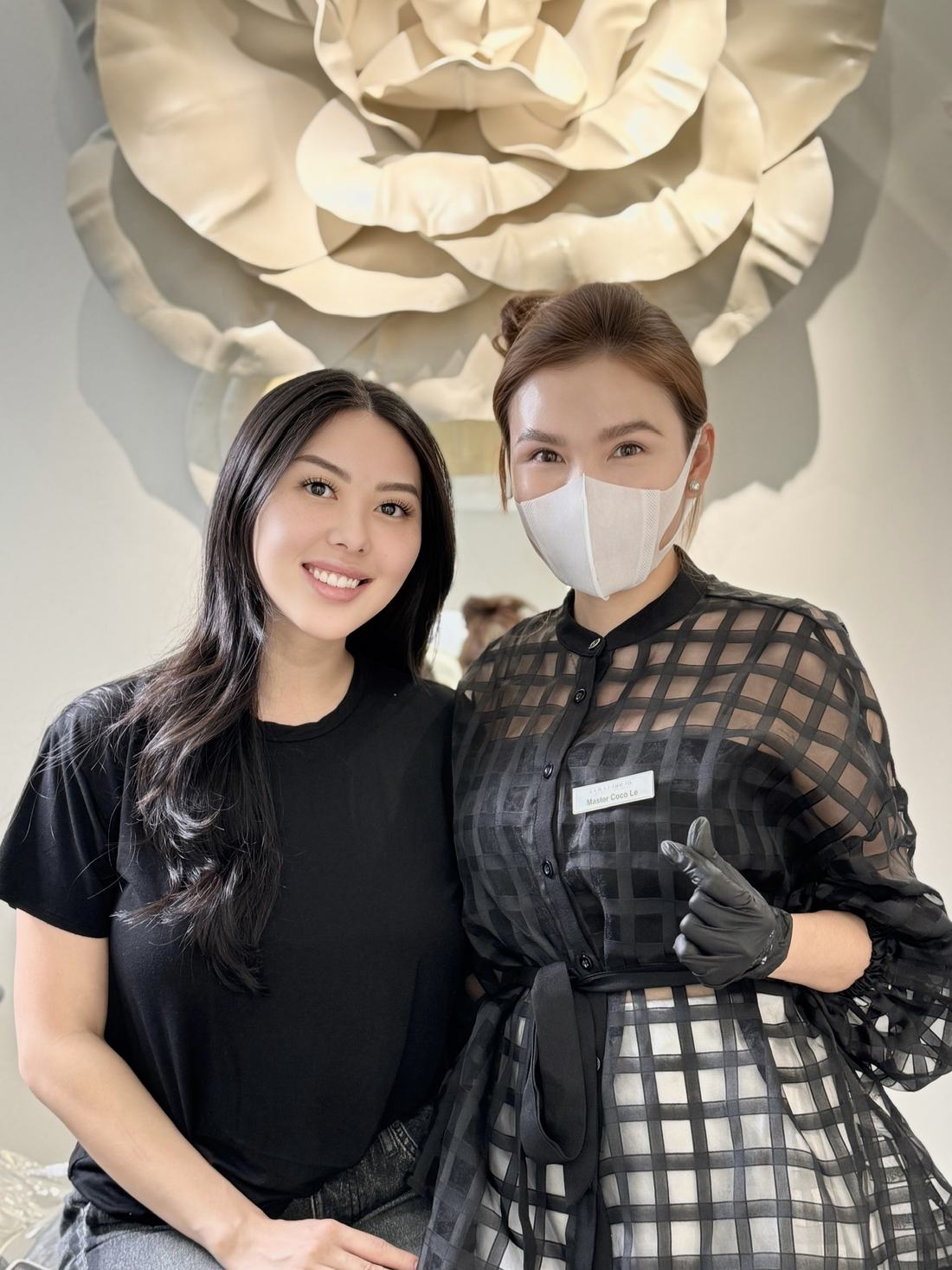 Client with her new brows standing beside Master Coco Le at the COCO BROW studio